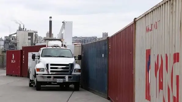 U.S. Customs and Border Protection officers inspect cargo containers as Section 301 tariff enforcement intensifies