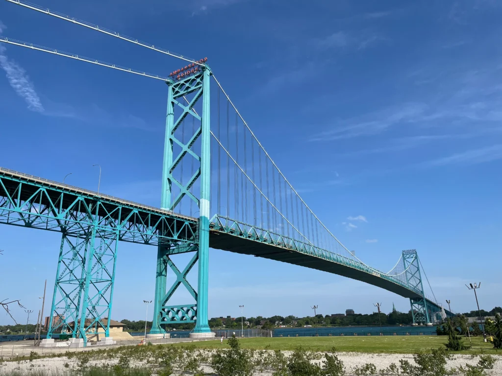 Commercial trucks crossing the U.S. Canada border, illustrating trade exposure under new 50% tariffs